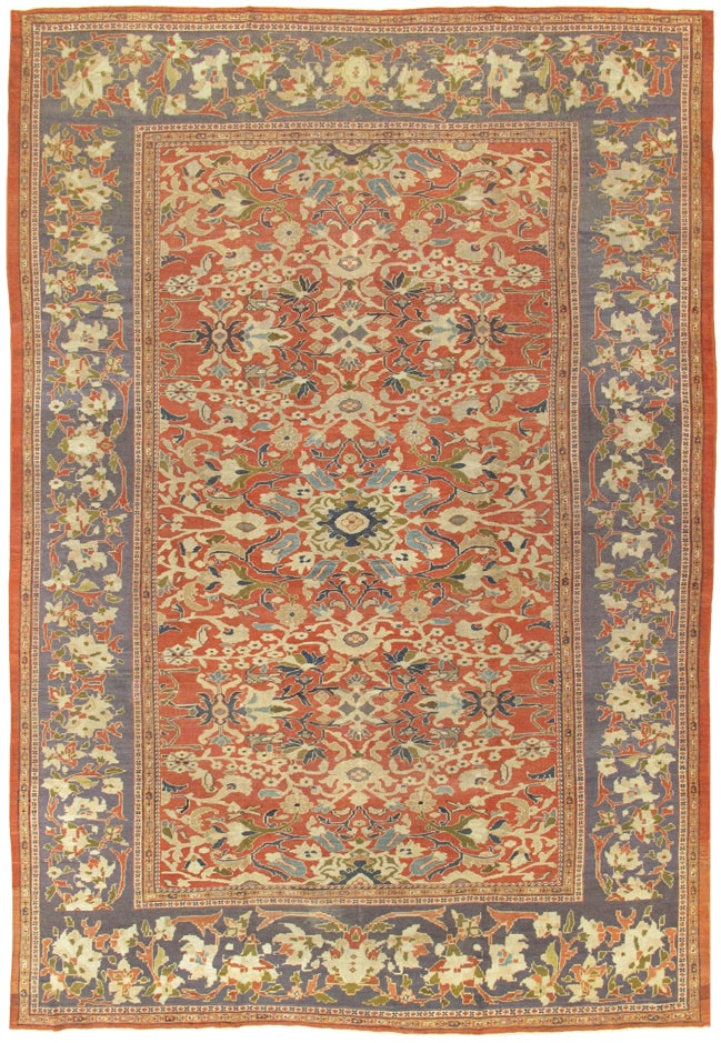 Antique Sultanabad Carpet, West Persia, 10' 1'' X 14' 7'': The richly abrashed terracotta field decorated with an expansive all-over design of scrolling vinery, palmettes, and stylized floral motifs rendered in soft tones of rust and purple. The spacious comp