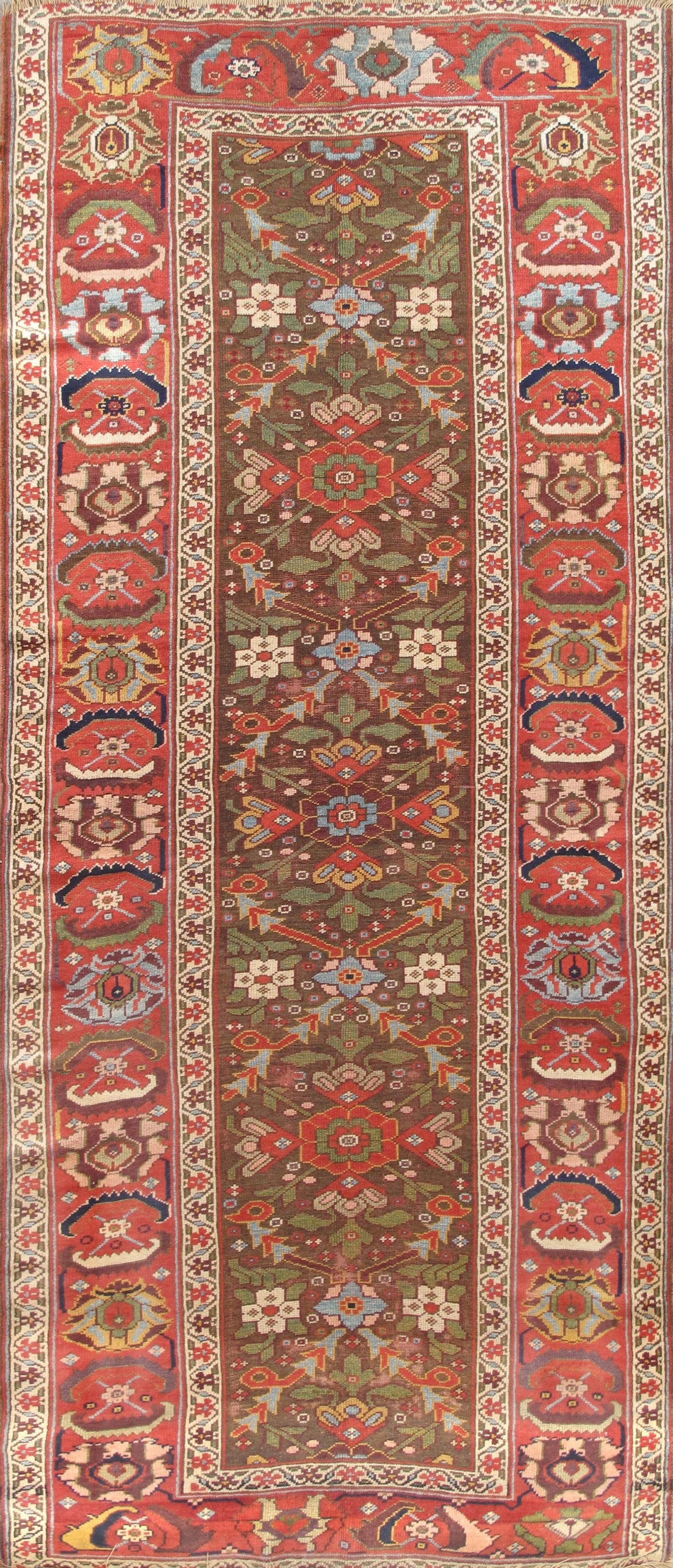 Antique Northwest Persian Runner, 4' 2'' X 9' 5'': Measuring approximately 4 ft. 2 in. x 9 ft. 5 in., this elegant runner is woven in fine hand-spun lamb’s wool. The warm brown field is enlivened by an allover arrangement of stylized floral and 