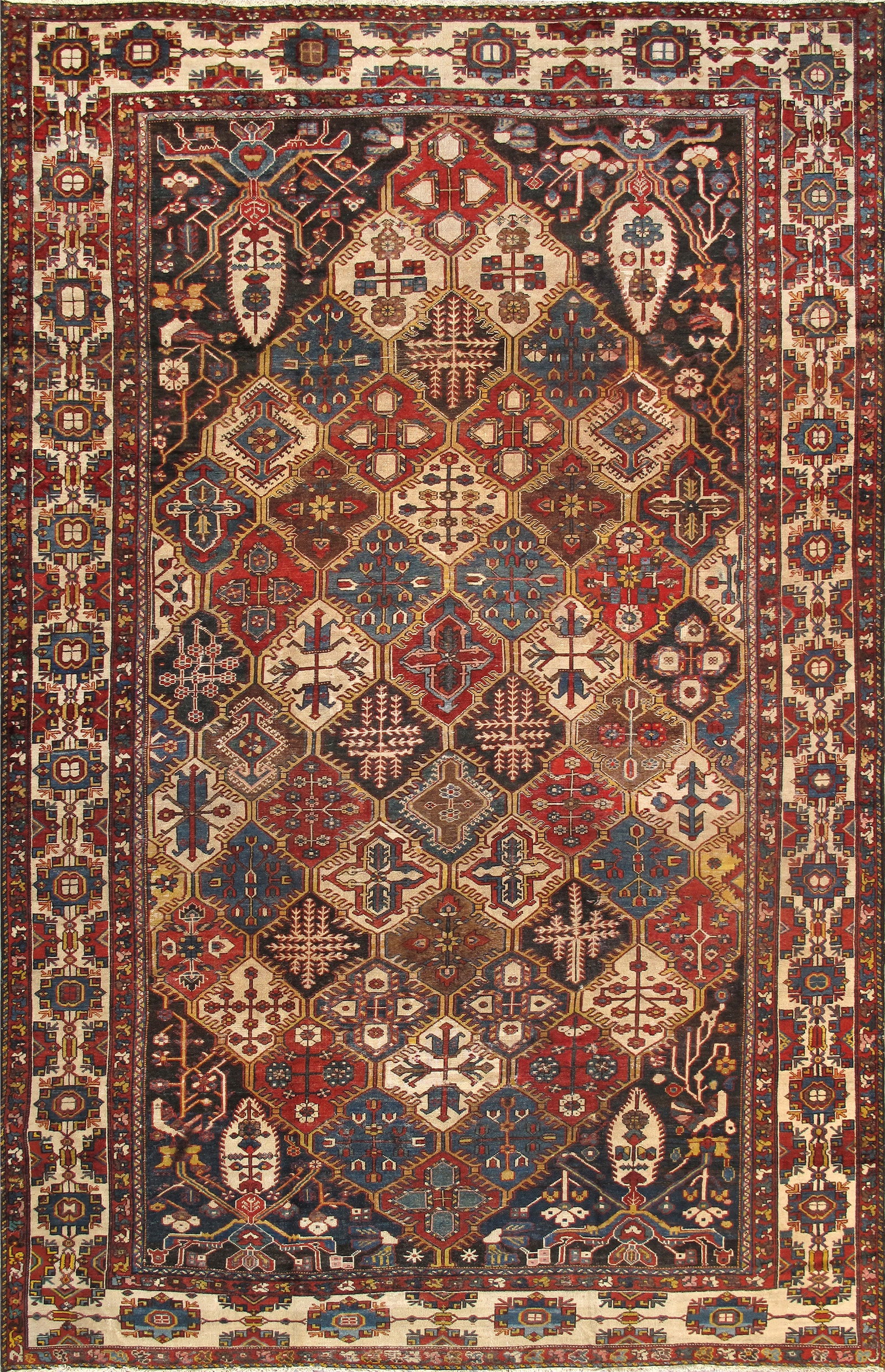 Antique Bakhtiari Carpet, Southwest Persia, 10' 7'' X 16' 9'': Measuring approximately 10 ft. 7 in. x 16 ft. 9 in., this vibrant Bakhtiari carpet is hand-knotted in fine lamb’s wool. The intricate allover design is rendered in a lively polychrome palette se