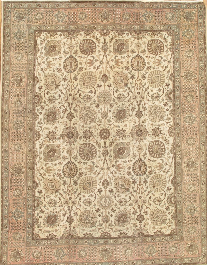 Vintage Persian Tabriz Allover Carpet, 9' 9'' X 12' 9'': A luminous antique carpet from Tabriz, this piece unfolds with a graceful allover design drifting across a serene ivory ground softened by delicate salmon hues. The fine lamb’s wool lends a gent