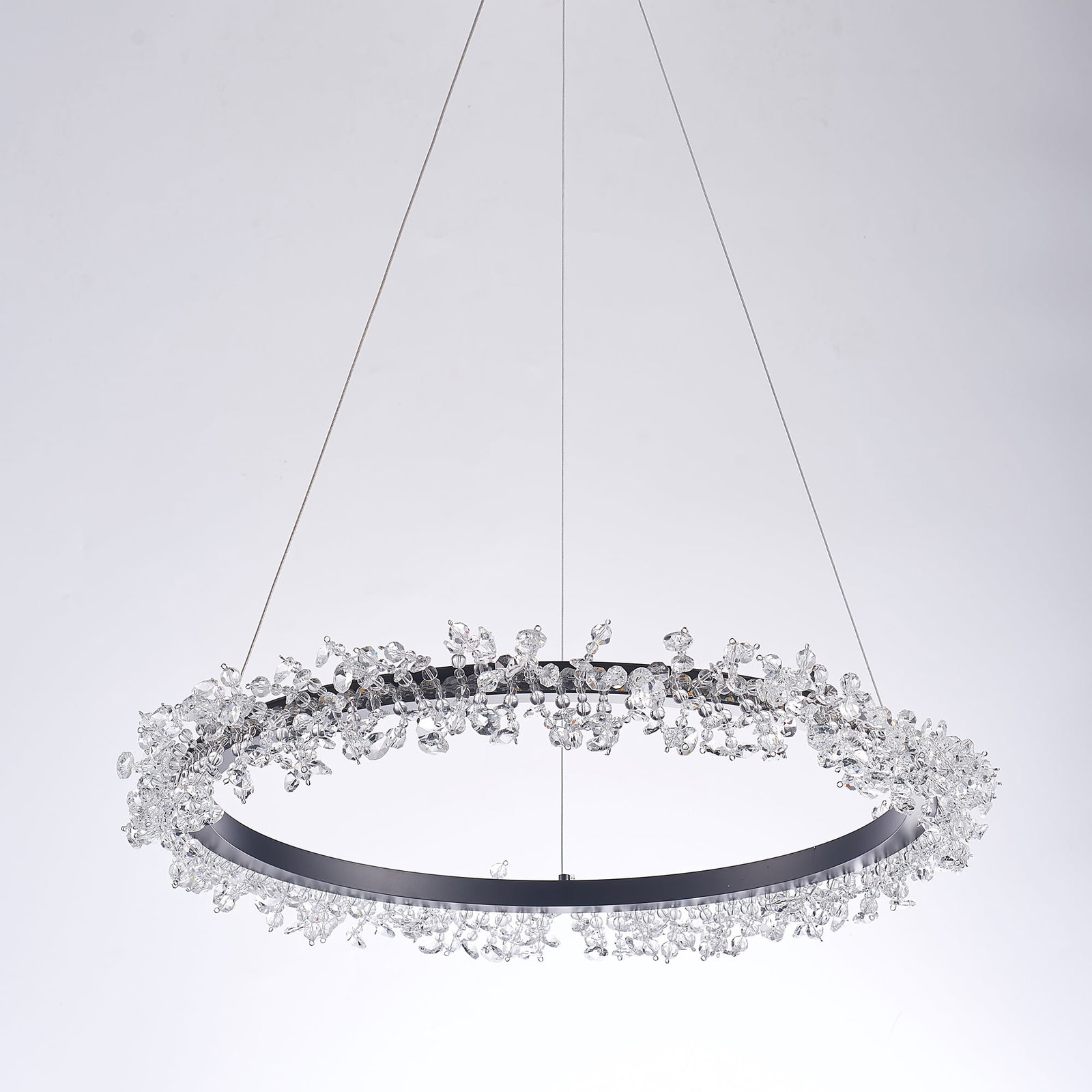 Claire Brushed Silver & Lucite Chandelier: The Claire chandelier features a circular brushed silver frame adorned with cascading lucite water droplets, creating a shimmering effect as the light catches each surface. Delicate yet striking, it