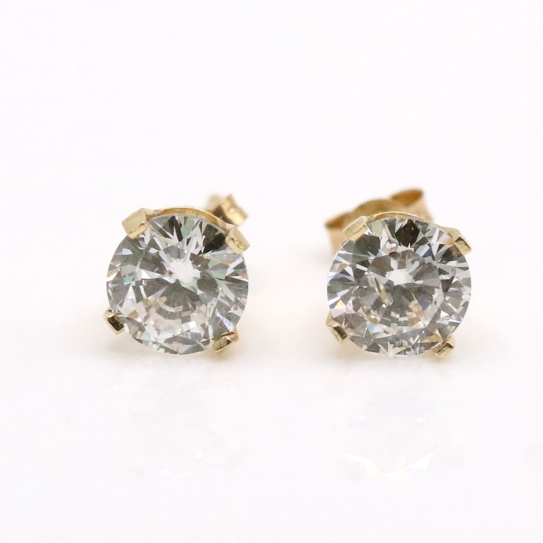 APPR $2500 Diamond 14Kt Gold Earrings: CENTER GEMSTONE REPORT # - 107246 GEMSTONE - DIAMOND TREATMENT - LAB GROWN QUANTITY - 2 CUT SHAPE/STYLE - ROUND BRILLIANT COLOR RANGE - G-H CLARITY RANGE - SI2 WEIGHT (EST) CT - 2 SIZE (mm) - 6.3 COMP