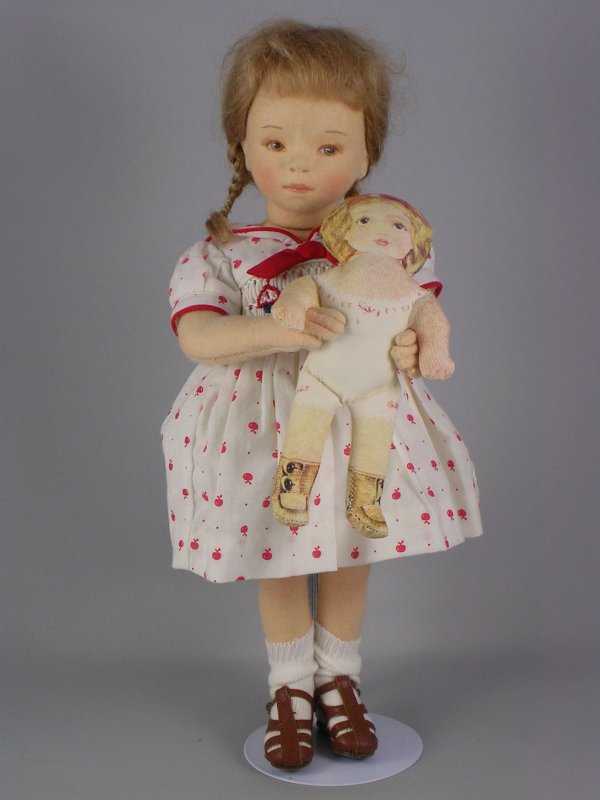 12" MILLY BY R. JOHN WRIGHT: 2006 Club Edition from the "Playtime Collection." Pressed wool felt, painted facial features, mohair braids. Holding lithographed cloth doll. Number 238.