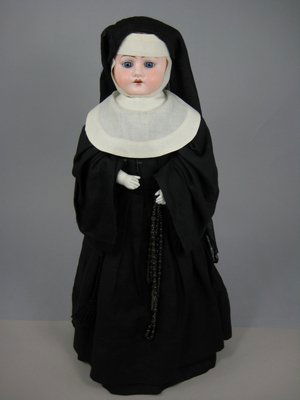 20" HEINRICH HANDWERCK SHOULDER HEAD NUN DOLL: Marks: Hh./ 0/ H. on bisque shoulder head. Antique blonde mohair wig with fixed blue eyes. Open mouth, gusseted kid body, bisque lower arms. Vintage nun's habit with cross and rosary beads. Circa 1910