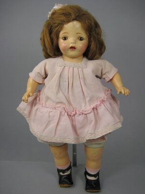 20" COMPOSITION GEORGENE AVERILL RECORTRAK DOLL: Unmarked. Composition head with tin sleep eyes, open mouth with teeth. Cloth torso with record player and upper legs, composition arms and lower legs. Vintage clothing. Some crazing and flaking of pai