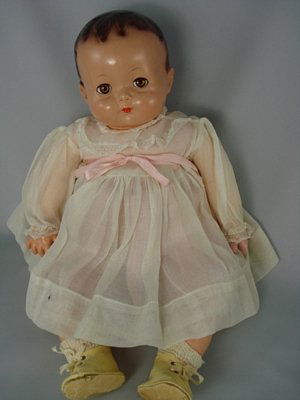 18" COMPOSITION BABY BY EFFANBEE: Marks: Effanbee//C (in circle) (illegible) on head. Composition head with flirty sleep eyes, closed mouth, molded and painted hair. Firmly stuffed cloth body with composition hands and lower legs. Wea