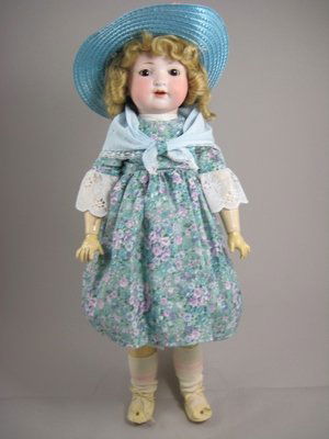 22 1/2" ARMAND MARSEILLE GERMAN CHILD: Marks: A 985 M//Germany//7 on bisque socket head. Sleep eyes, open mouth with teeth. Fully jointed composition body with minor flaking.