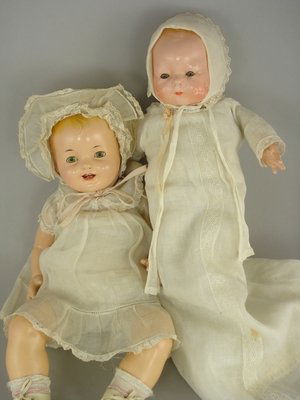 12" COMPO HORSMAN TYNIE BABY & 16" EFFANBEE LOVUMS: 1.) Marks: C. 1924//EIH Inc on head. Sleep eyes, molded hair. Old cloth body with composition gauntlet hands. Wearing original tagged baby gown and bonnet. Paint has flaked on face and hair, with some