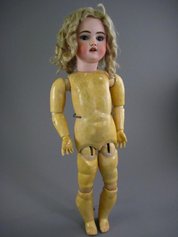 21" SIMON & HALBIG 1079 DOLL : Marked as shown. Blue threaded sleep eyes, open mouth, pierced ears, fully jointed wood and compositon body with excellent original finish, antique blonde mohair wig. A few wig pulls. Circa late 1800s