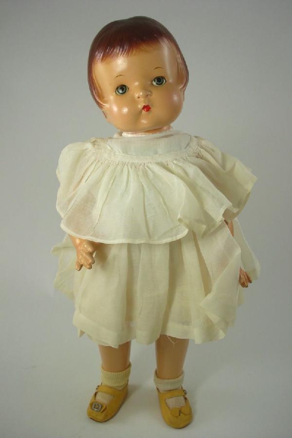 19" COMPOSITION PATSY ANN BY EFFANBEE: Marked as shown on back. Sleep eyes with real upper lashes, molded and painted hair. Jointed composition body; original clothing, possibly original shoes. Original paint and very minimal crazing. 1930