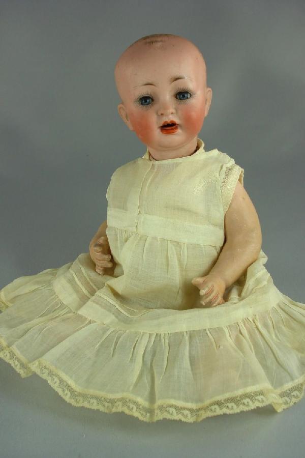 10" HERTEL SCHWAB 151 CHARACTER BABY: Marked as shown on solid dome bisque socket head. Sleep eyes with real upper lashes, open mouth with two upper teeth and molded tongue, painted hair. Jointed composition bent-leg chubby baby body. Ant