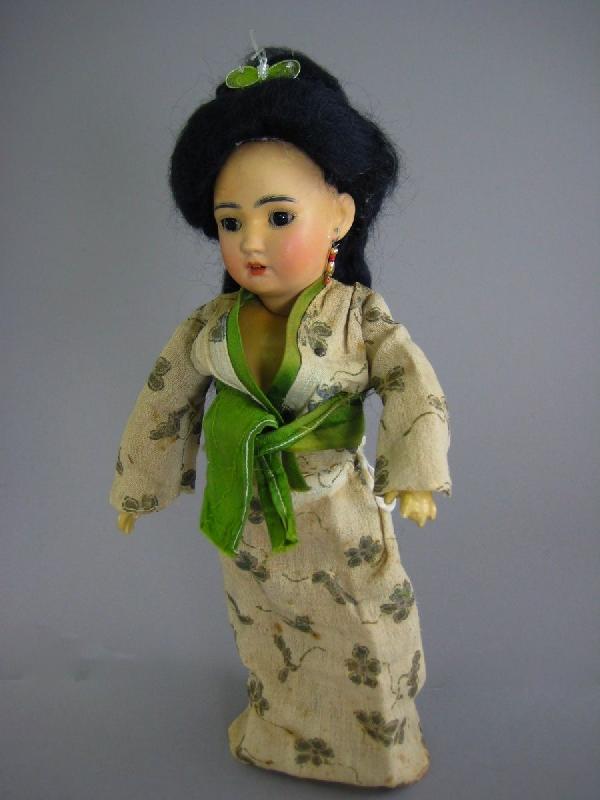 12" SIMON AND HALBIG ORIENTAL LADY #1329: Marked "SIMON AND HALBIG//Germany//1329". Bisque socket head has black pupil-less eyes, open mouth, pierced ears, mohair wig, fully jointed wood and composition body and wears a handpainted kimono. He