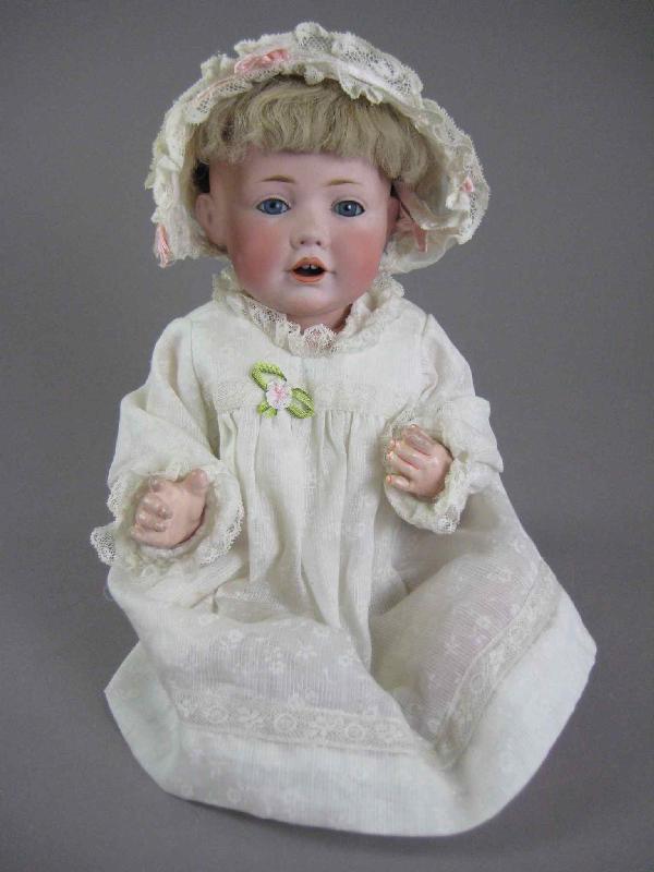 12" J.D. KESTNER HILDA CHARACTER BABY: Back of bisque socket head is marked as shown and has no damage. Blue sleep eyes with delicate light gray painted lashes and light brown feathered brows, rosy cheeks, open mouth with two upper teeth,