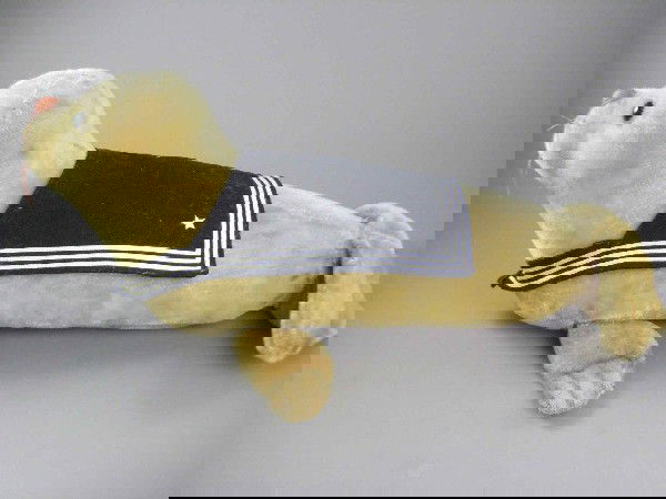 25" 1950 STEIFF MOHAIR SEAL: This rare studio piece has large black glass eyes, stitched nose (one section loose) and stitched flippers. He wears a large wool sailor collar with embroidered stars. Some wear on the flippers. Circa