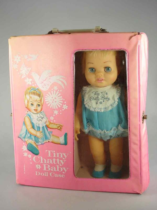 TINY CHATTY BABY - ALL ORIG IN CASE - TALKS!: 15" Tiny Chatty Baby by Mattel has a vinyl head with sleep eyes and rooted hair. Jointed hard vinyl body. Wearing original name romper and slippers. She's in pristine condition and she talks! Includes