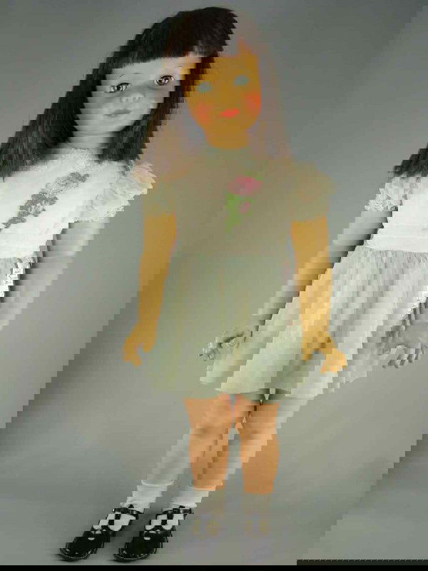 35" PATTI PLAYPAL IN TAGGED DRESS: Marks: Ideal Doll//35 on head; Ideal Doll in oval on back. Sleep eyes, long dark brunette rooted hair, vivid facial coloring. Five-piece hard plastic body. Wearing tagged dress, matching panties (some