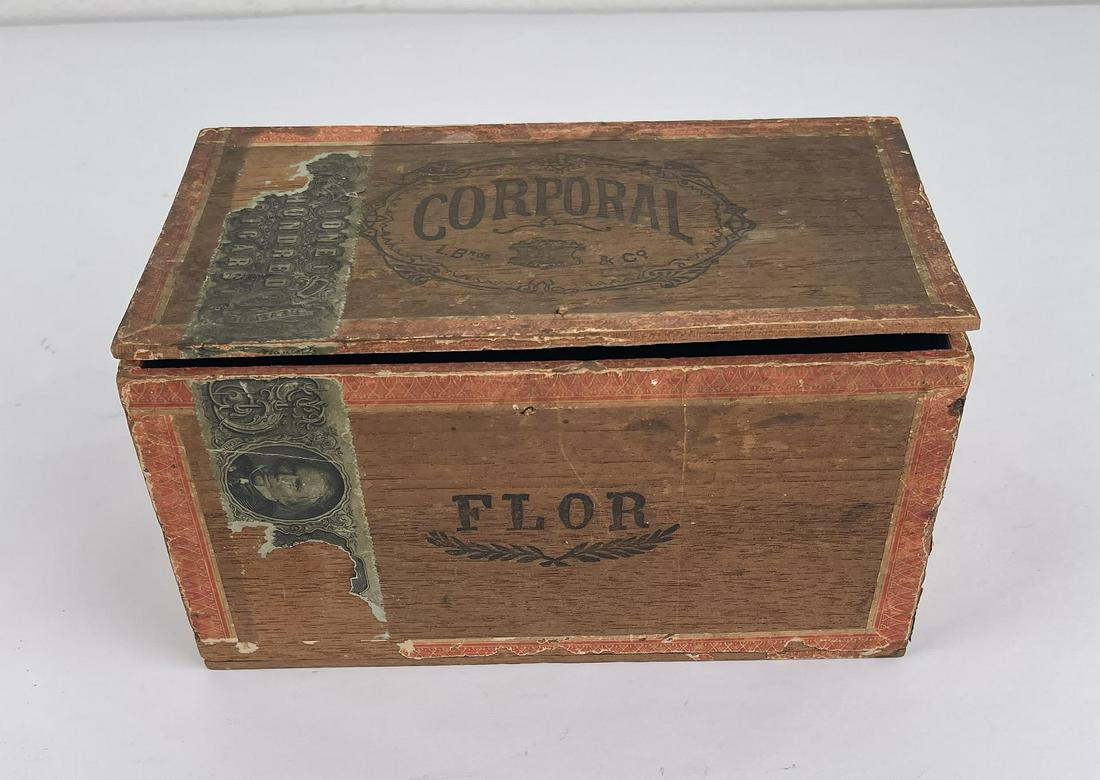 Antique Corporal Flor Cigar Box: 100 Cigar box. Very nice example. Wonderful US Cavalry Vignette of a soldier.