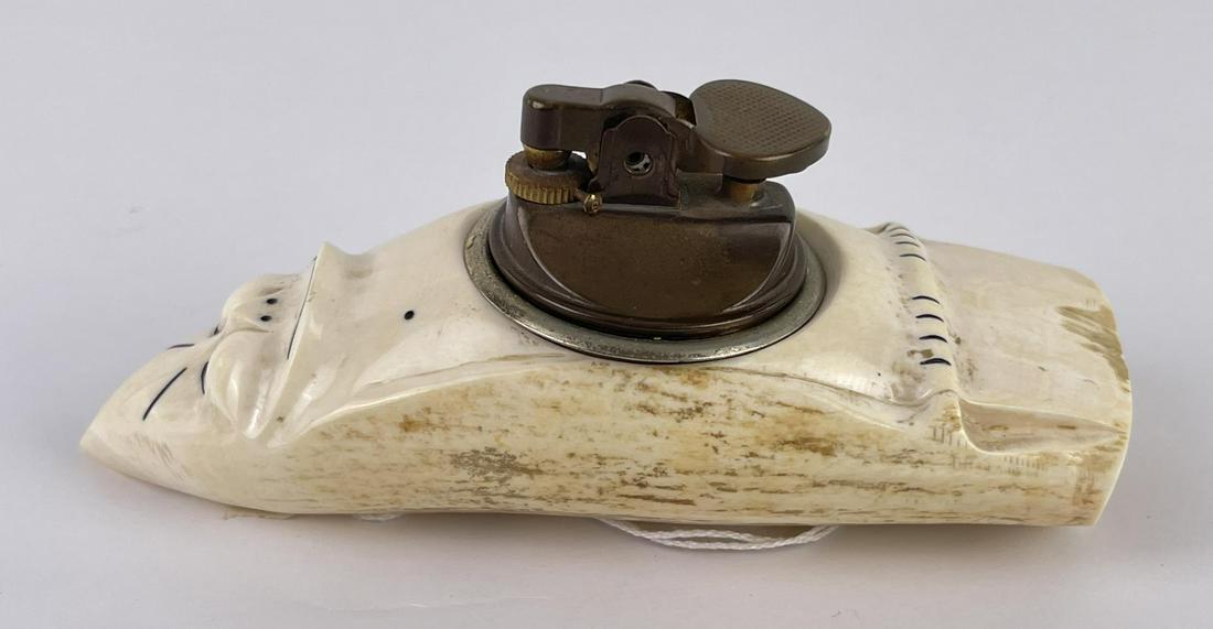 Antique Eskimo Inuit Scrimshaw Whale Tooth: Lighter in the form of a Billiken. 5 1/2" long. Allard Auction Collection Inv: AA1 50865