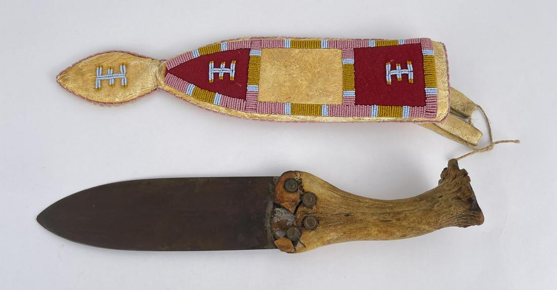 Native American Indian Dag Knife and Sheath: Very nice set. Beaded sheath. Knife handle has damage as shown. Second half of the 20th Century. Knife is 14" long.