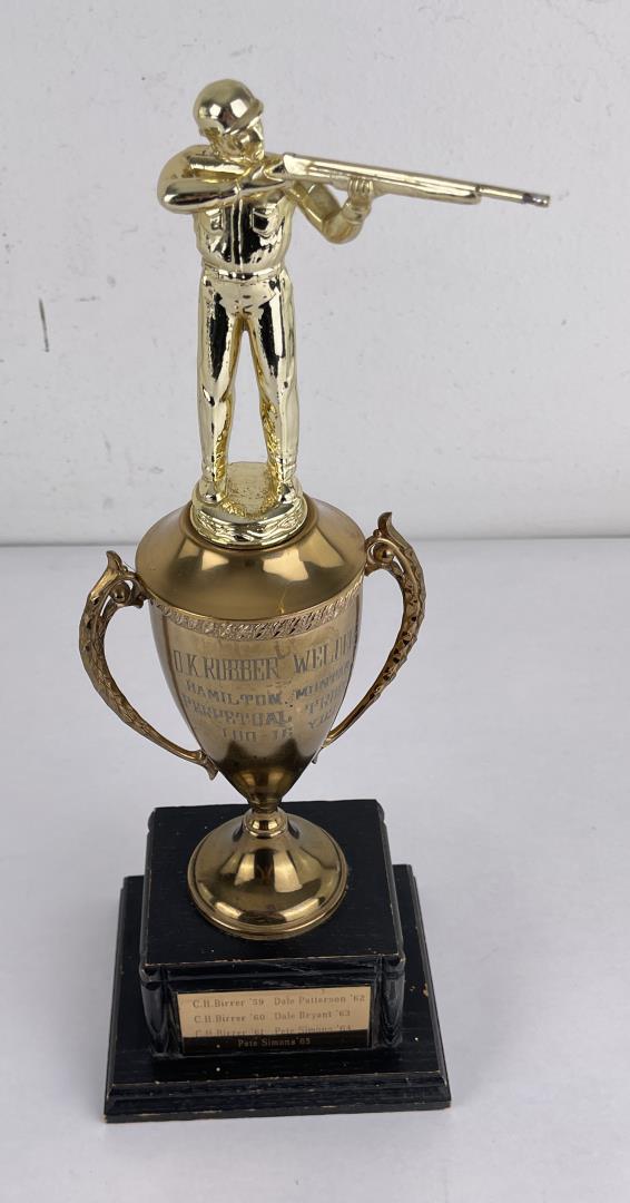 Hamilton Montana Shooting Trophy: Rubber Welding Perpetual Trophy. 14 3/4" tall.