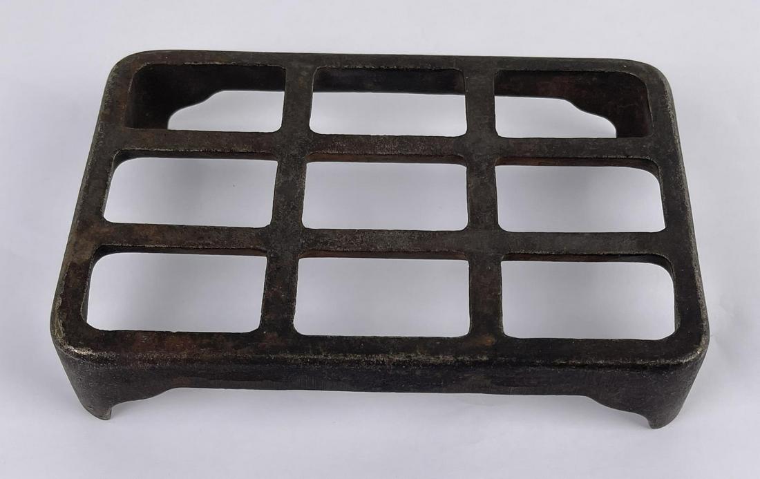 Vintage Cast Iron Trivet: Measures approximately: 5 1/2" x 8". Maker/origin unknown.