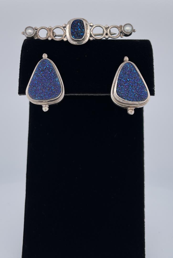 Vintage Sarda Sterling Silver Blue Drusy Set: Very nice pair of post back triangular shaped earrings, paired with Sterling Silver blue drusy and pearl brooch. Stamped Sarda 925. Brooch is 1 3/4" long, earrings are 1/2" wide.