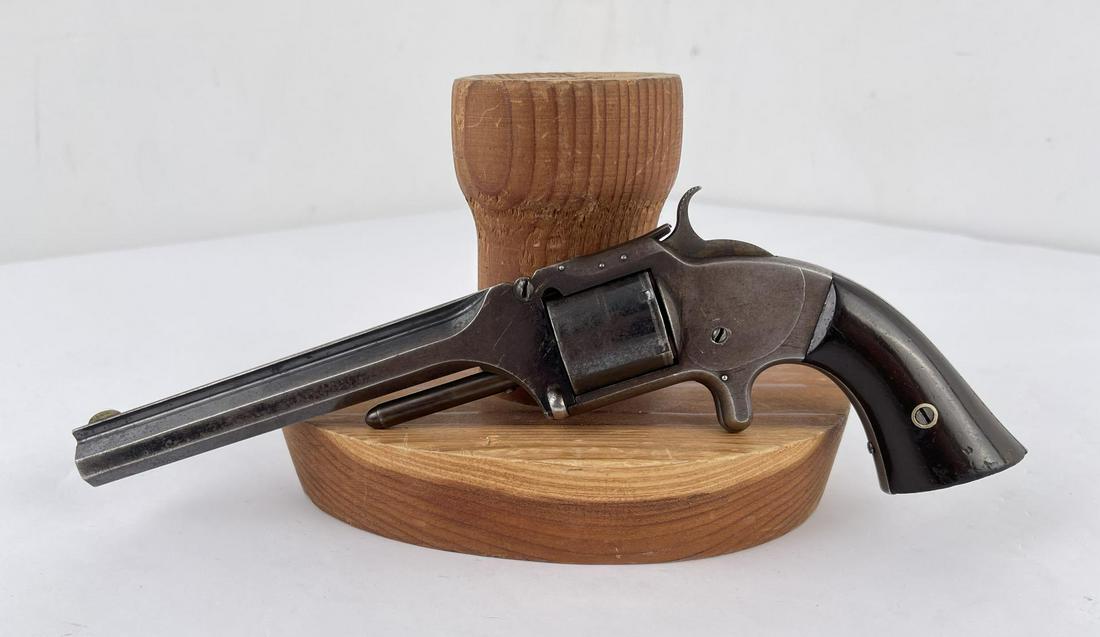 Smith and Wesson Model Number 2 Old Navy .32 RF: #43187 6 shot Non-Fluted cylinder. Tip-Up Revolver, top of 6" octagon barrel stamped "Smith & Wesson Springfield, Mass.” Cylinder stamped “Patented April 6, 1885 – July 5, 1859 & Dec. 13, 1860.