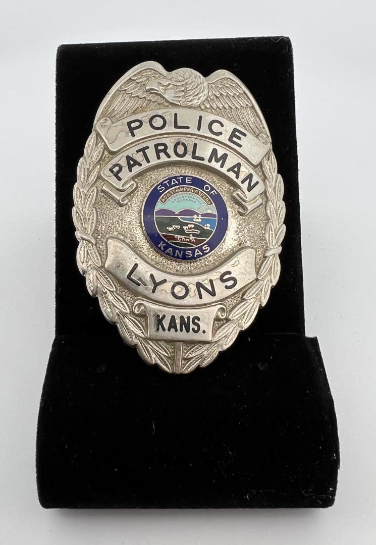 Police Patrolman Lyons Kansas Badge: 2 1/2" long. Identified to Chris Dettmer. Provenance: Jack Ooley Collection.