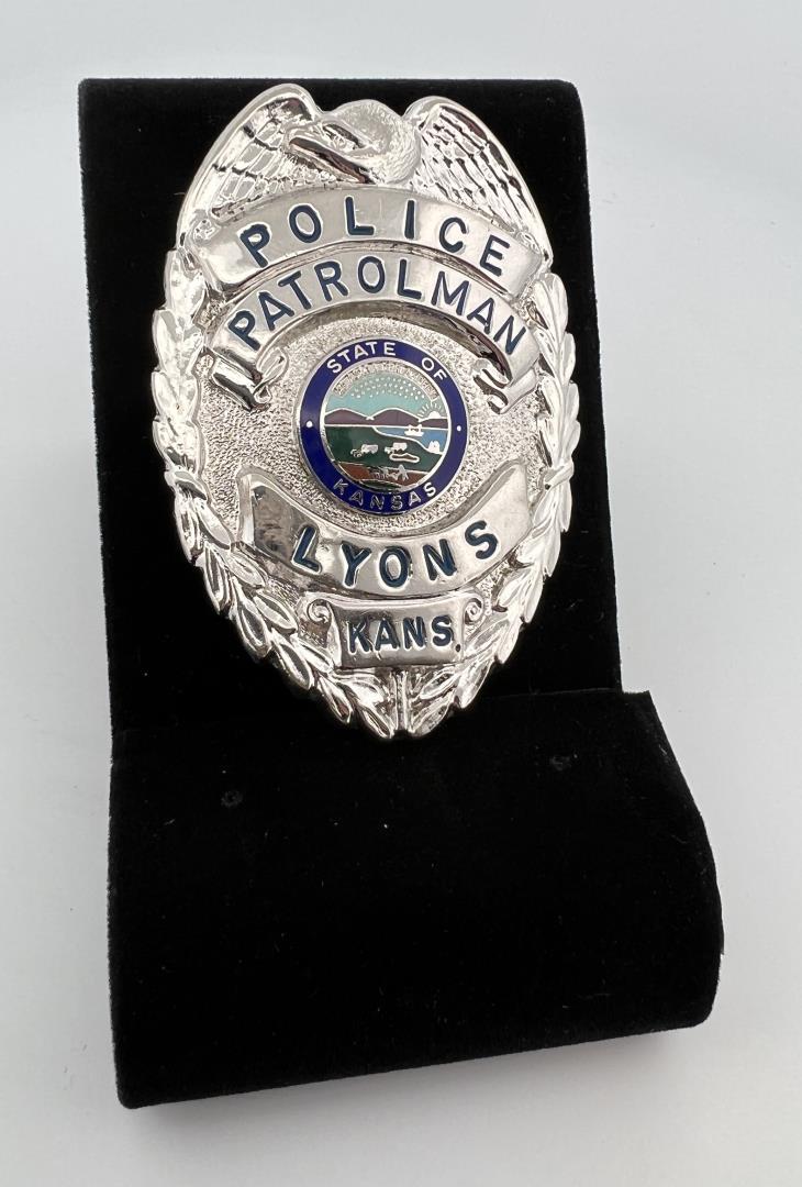 Police Patrolman Lyons Kansas Badge: 2 1/2" long. Provenance: Jack Ooley Collection.
