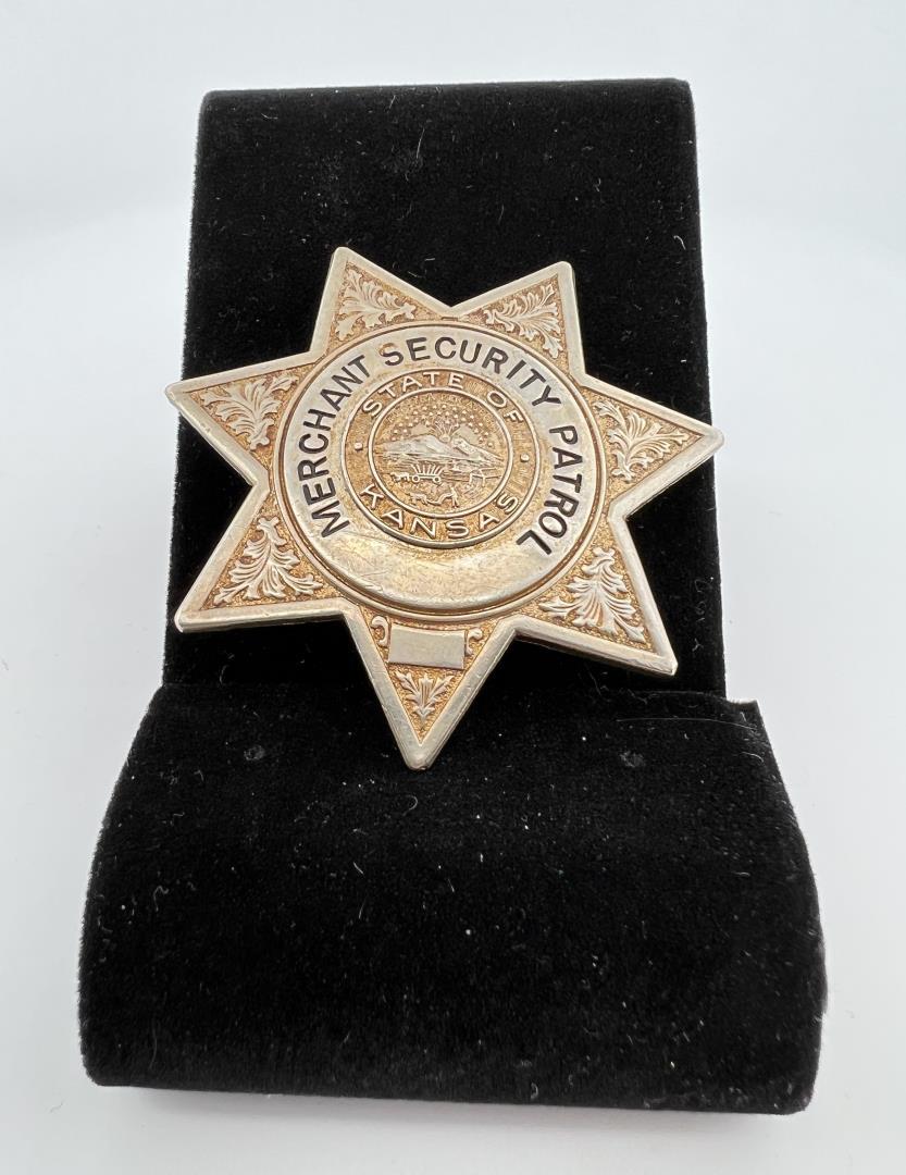 Kansas Merchant Security Patrol Badge: 2" diameter. Provenance: Jack Ooley Collection.
