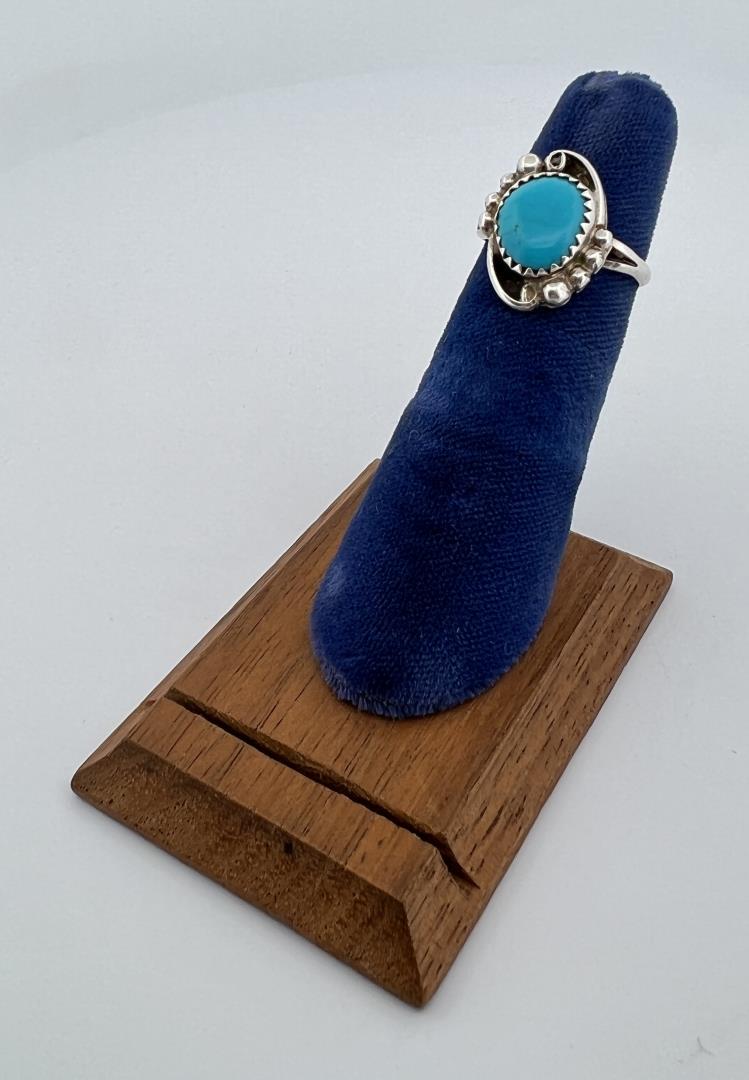 Navajo Sterling Silver Turquoise Ring: Beautiful blue coloration with elegantly styled setting featuring split band. Size 4