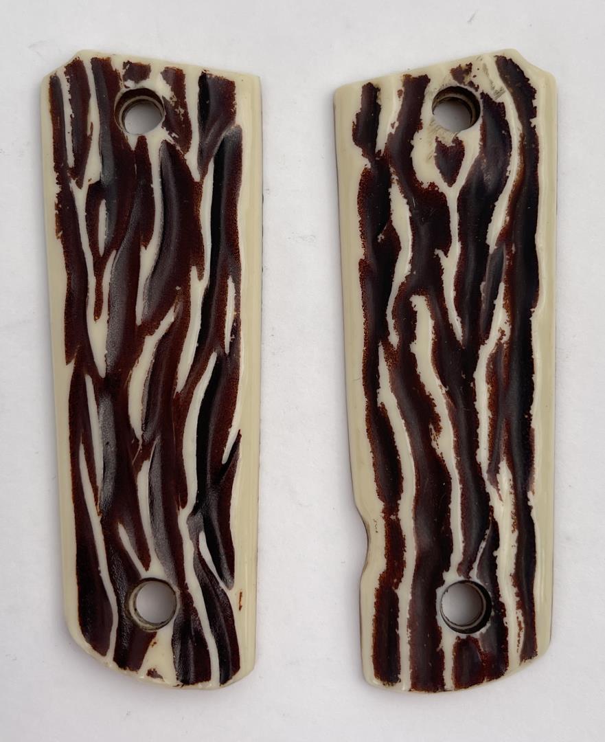 Colt 1911 Plastic Stag Pistol Grips: Nice set. Stag pattern.