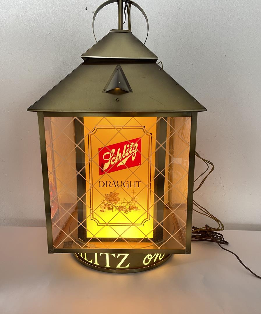 Schlitz Lighted Draught Beer Lantern Sign: Nice hanging sign. Working condition. Hard to find. 30" tall, 13 1/2" diameter.