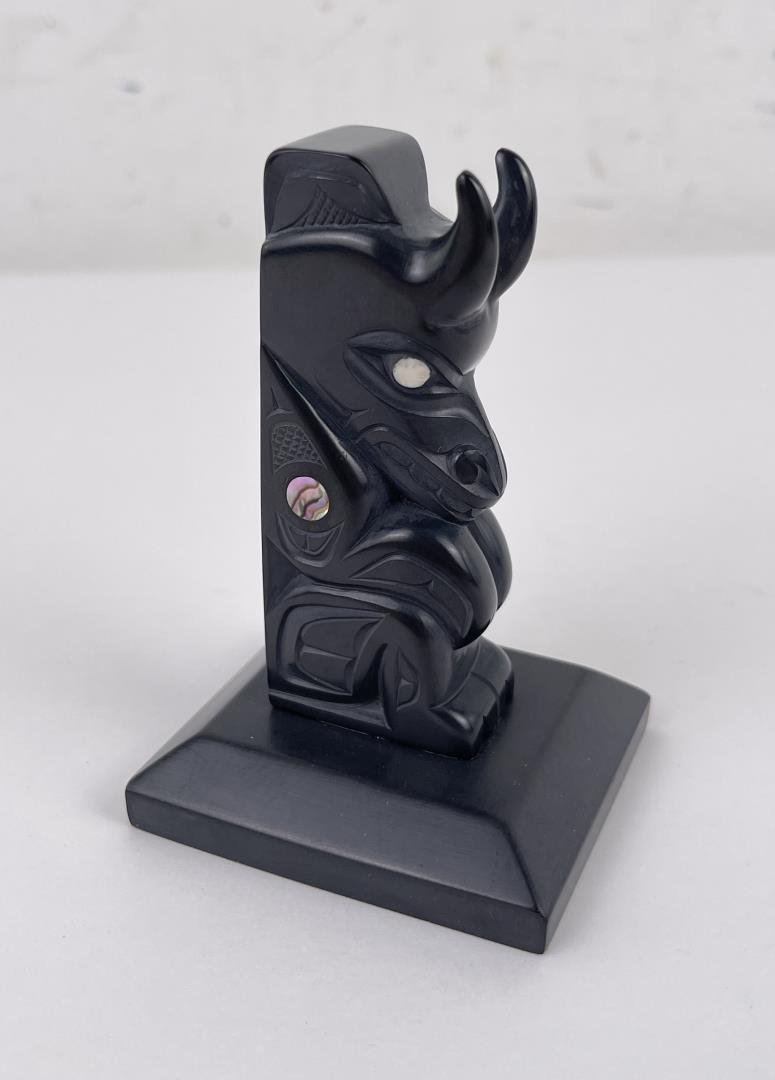 Haida Northwest Coast Indian Argillite Totem Pole: 3 3/4" tall. 2 1/2" by 2 1/2" base. Artist is Glen Pollard. Missing an abalone eye. Glen Pollard (Born 1957) is active/lives in British Columbia / Canada. Glen Pollard is known for Sculpture. Glen Pol