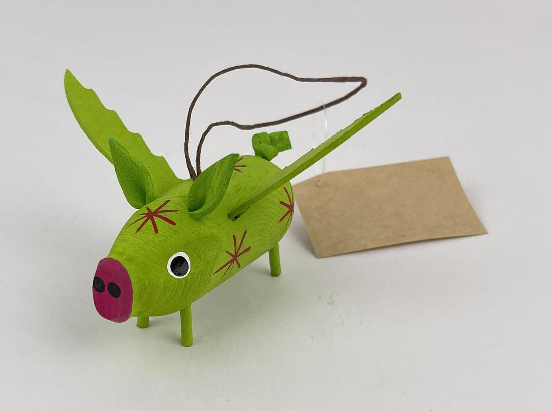 Chandler Begaye Navajo Folk Art Wood Carving: Nice folk art Flying Pig. Carved by Chandler Begaye. 3" long, 4 1/4" wide.