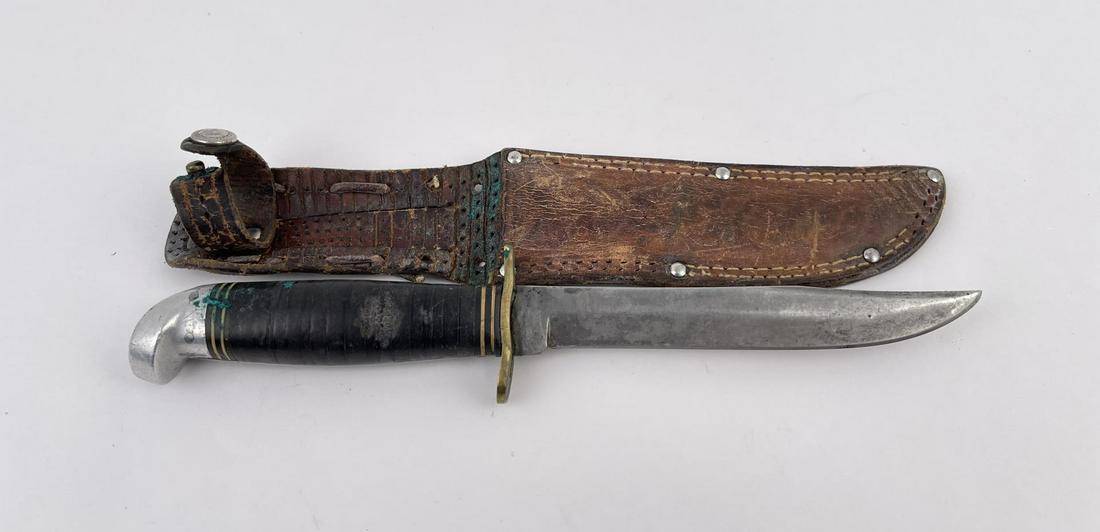WW2 Western Fighting Knife: Nice example. Sheath is named and missing stitches.