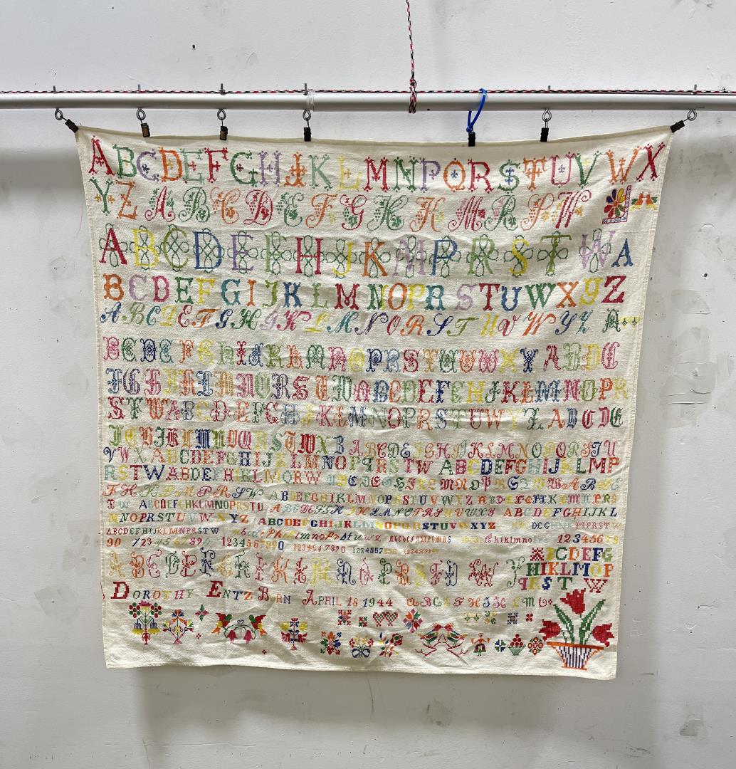 1944 School Sampler Folk Art: Named to a Dorothy Entz Boan. 34 1/2" by 35".