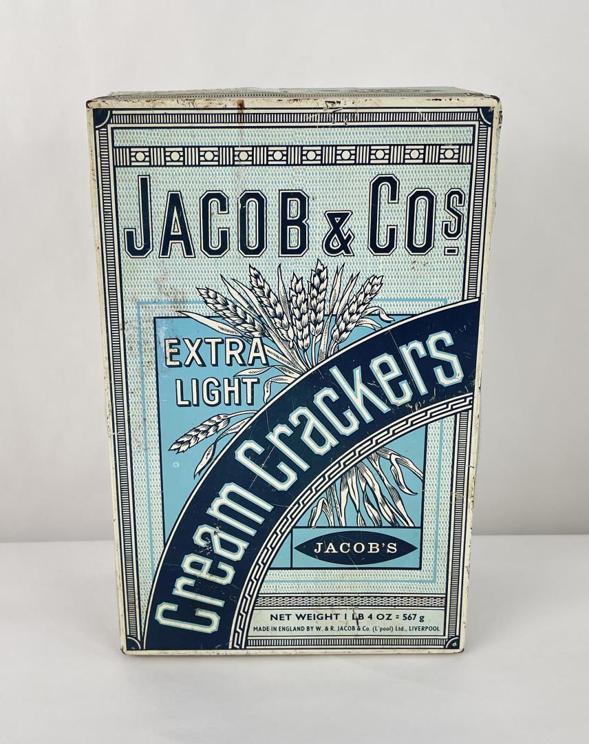 Jacob & Co Cream Crackers Tin: Antique Jacob & Co. 1lb, 40z. Cracker tin made in England. 10" tall. Tin is fairly sound.