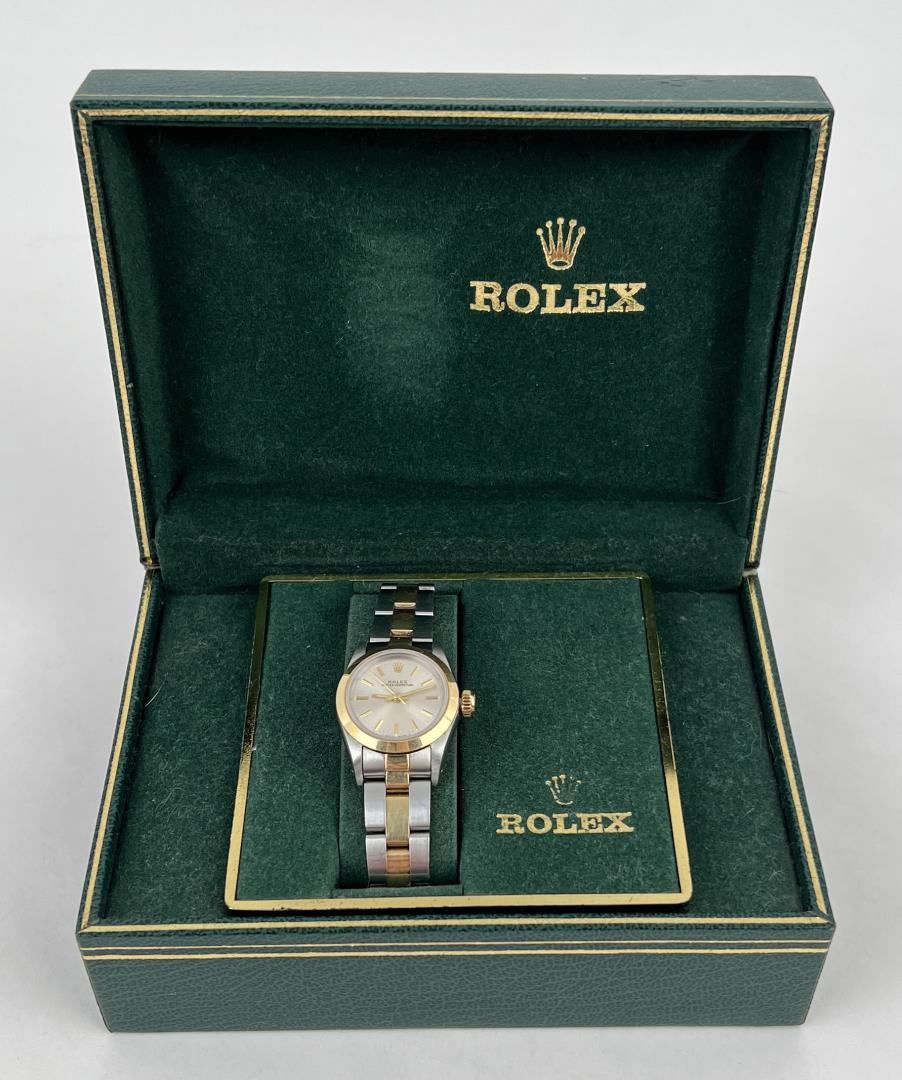 Rolex Perpetual 67183 18k Stainless Ladies Watch: Very nice watch in original box. Back hinge on box is broken. No papers. Should be serviced before daily use.