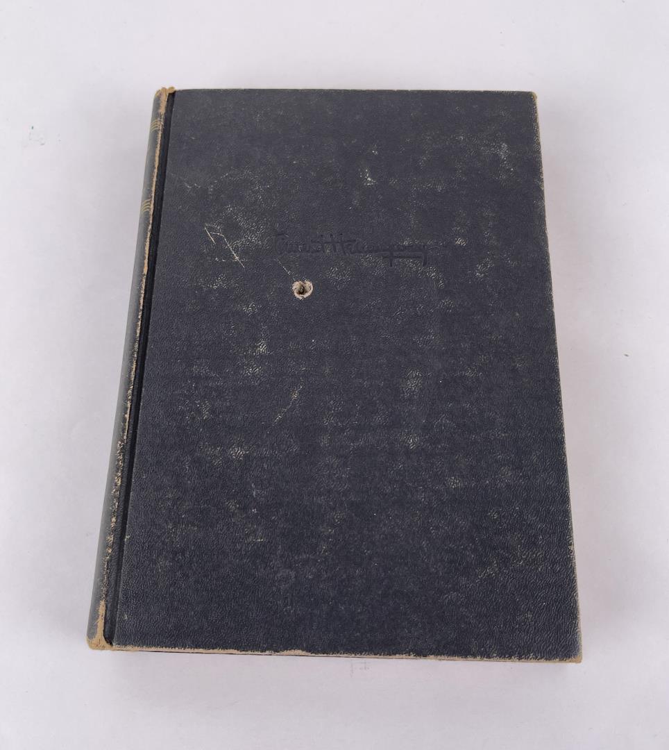For Whom the Bell Tolls: Ernest Hemingway. 1940. Appears to have a bullet hole through part of the book.