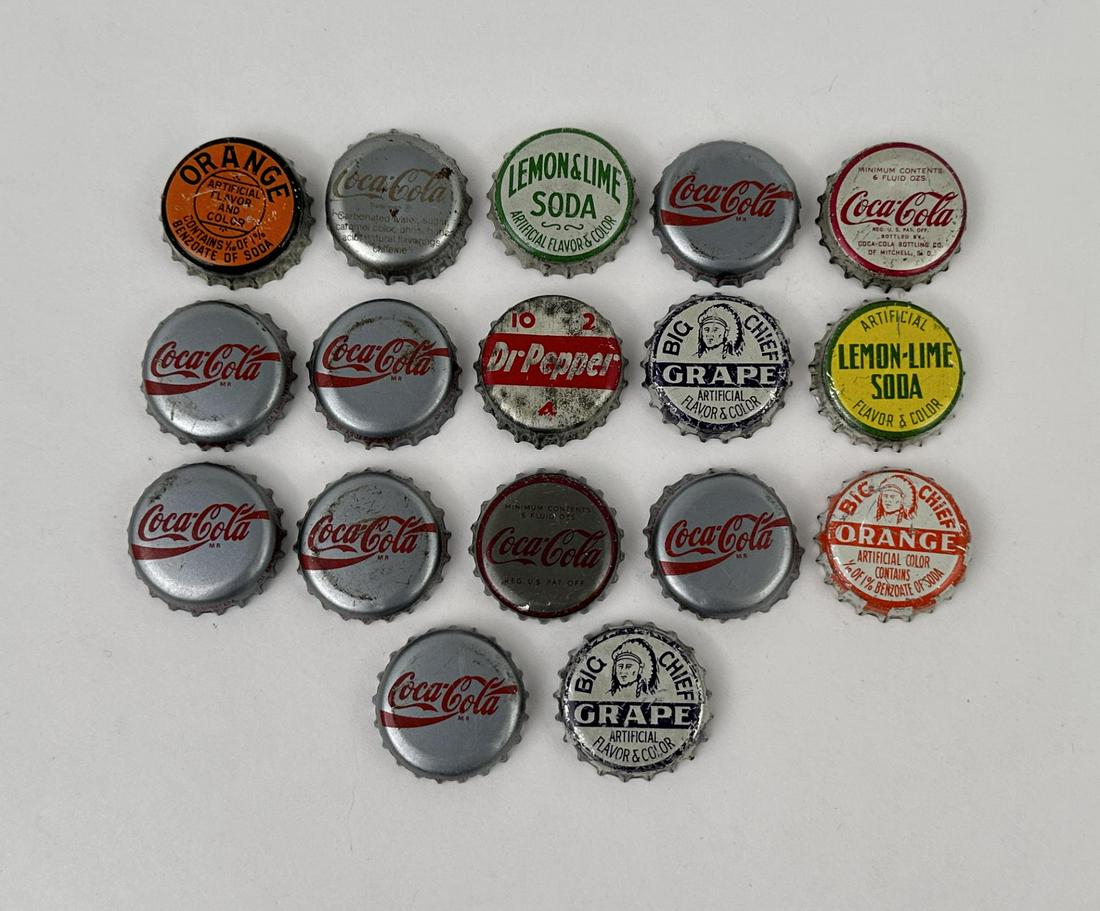 Collection of Vintage Bottle Caps: Big Chief, Coca Cola, Dr Pepper, and more.