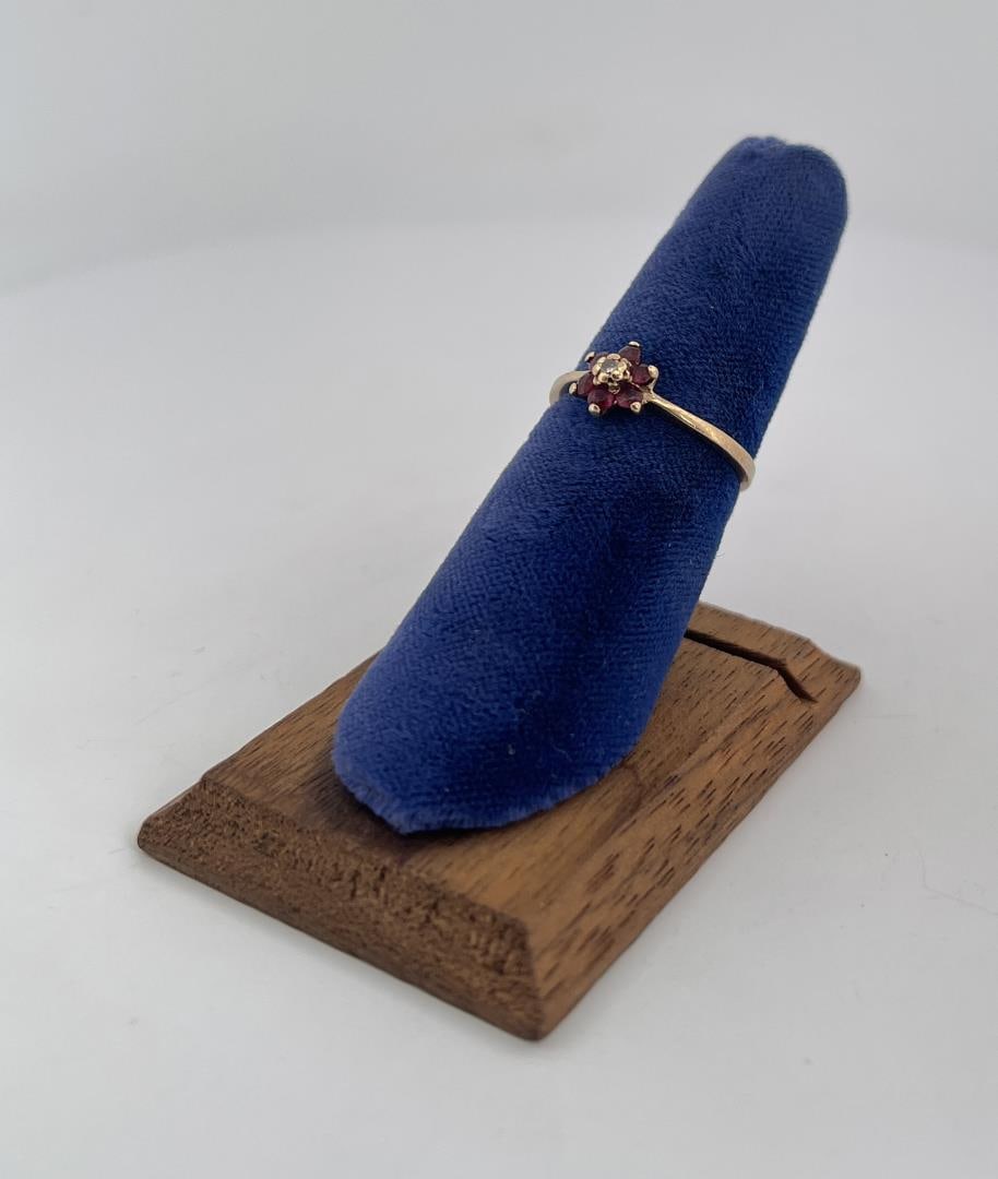 10k Gold Garnet and Diamond Ring: Size 6. 1.65 grams.