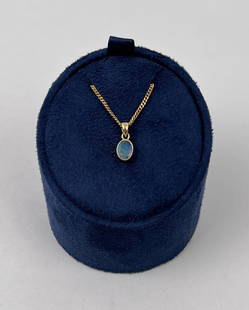 18K Gold Australian Opal Pendant on Chain: Pendant weighs .9 grams. Chain is 18" long and not gold.