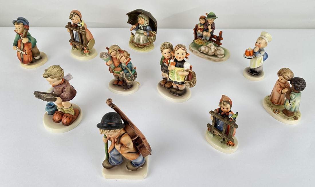 Collection of Goebel Hummel Figurines: 49 To Market, 89 Little Cellist, 203 Signs of Spring, 662 Friends Together, 128 Baker, 99 Eventide, 52 Going to Grandma's, 408 Smiling Through, 318 Art Critic, 218 Sweet Music.