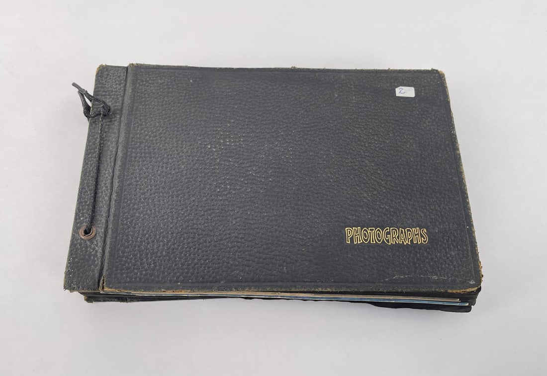 WW2 US Navy Montana Photo Album: Missoula Montana album with 50 plus pages from estate of Navy Sailor Bert Walker. Home and overseas images, some Japanese war souvenirs. 134 photos.