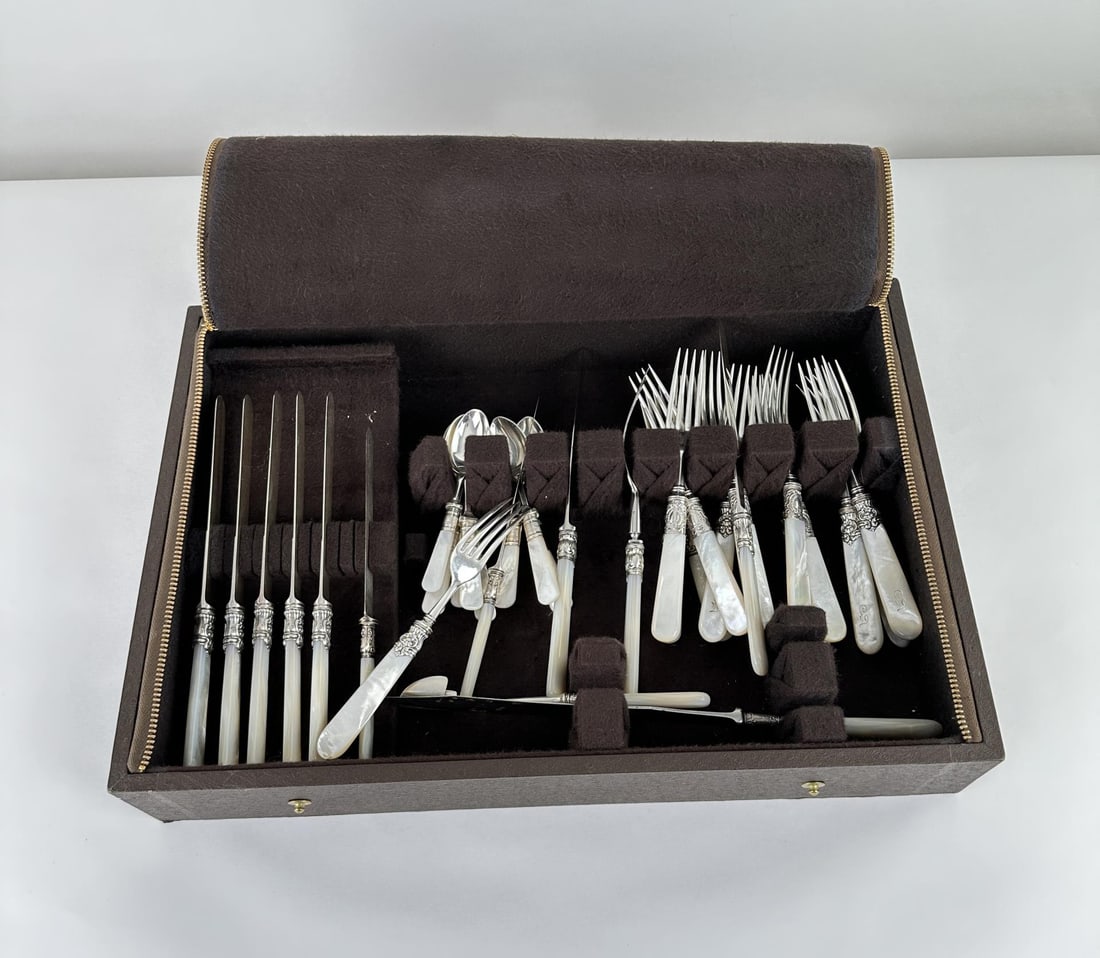 Mother of Pearl Handled Flatware: Very nice set.