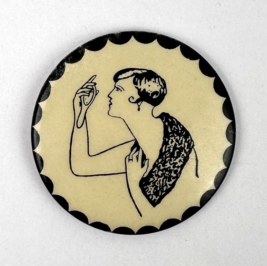 Art Deco Flapper Celluloid Pocket Mirror: 2" diameter.