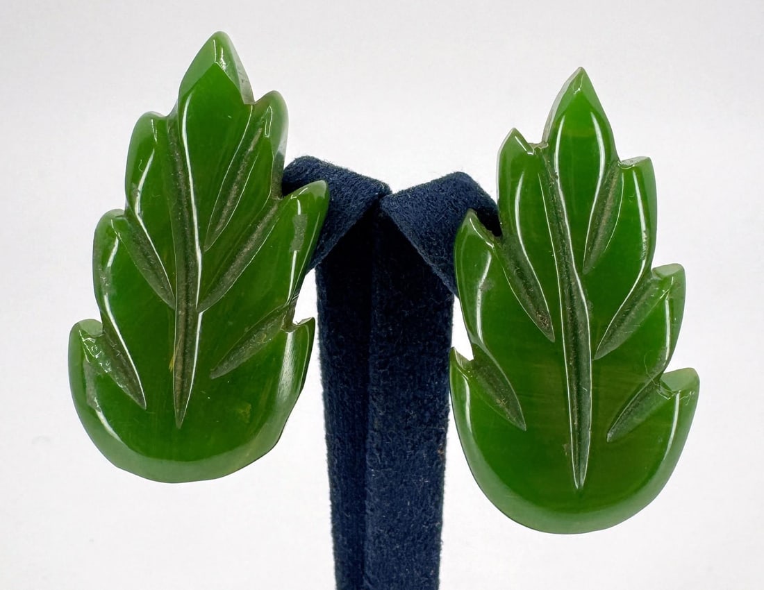 Antique Green Carved Bakelite Fur Clips: 2 total. 1 1/2" long by 3/4" wide.