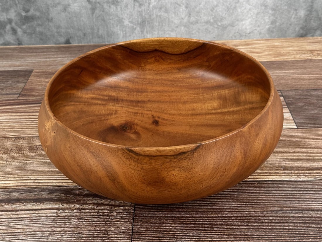 Michael Lee Hawaii Carved Milo Wood Bowl: 4" tall, 11 1/8" diameter. Mike Lee is Hawaii born and raised, and it shows. An avid surfer and waterman, he gets a lot of the inspiration for his wood carving from the ocean. An excellent and patient