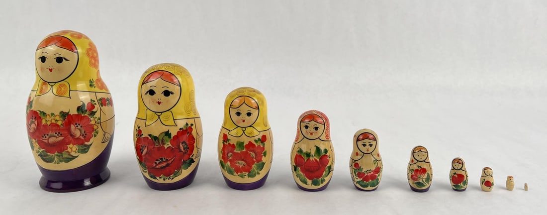 Traditional Russian Matryoshka Doll Set: 10 nesting dolls. The largest measures 7" tall by 3 3/4" in diameter.